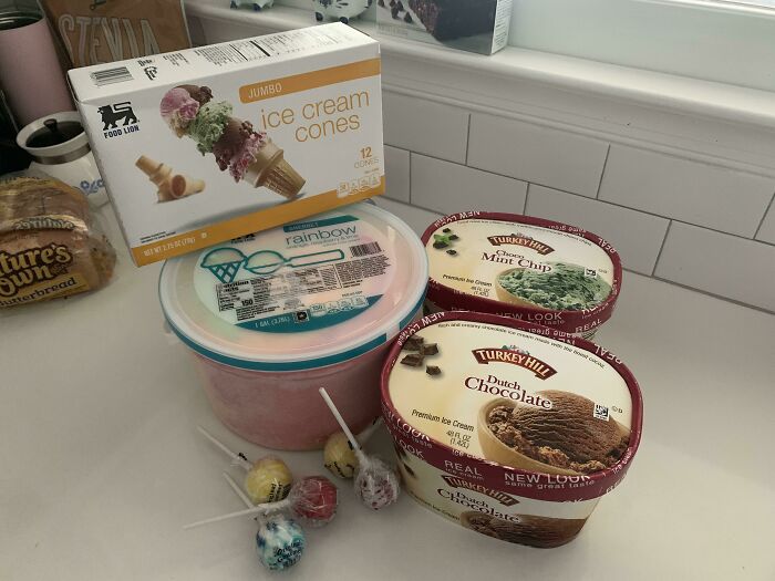 A pile of ice cream tubs and cones showing a silly thing wives do