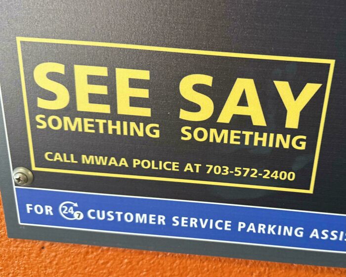 A poorly formatted sign reading SEE SAY SOMETHING SOMETHING, demonstrating a badly designed sign.