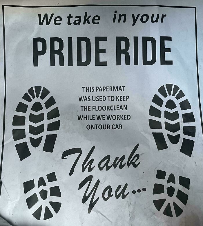 Paper floor mat from a car service with badly designed signs and formatting.