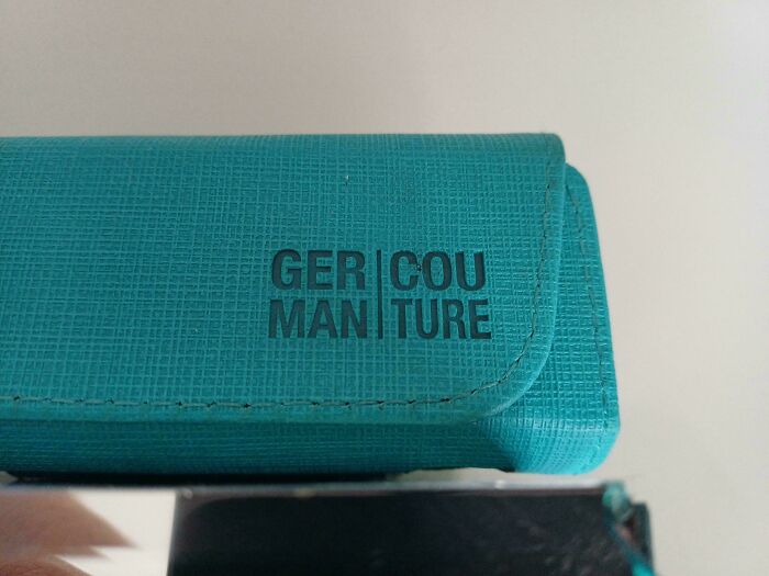 A teal case with awkwardly split brand text demonstrating badly designed signs