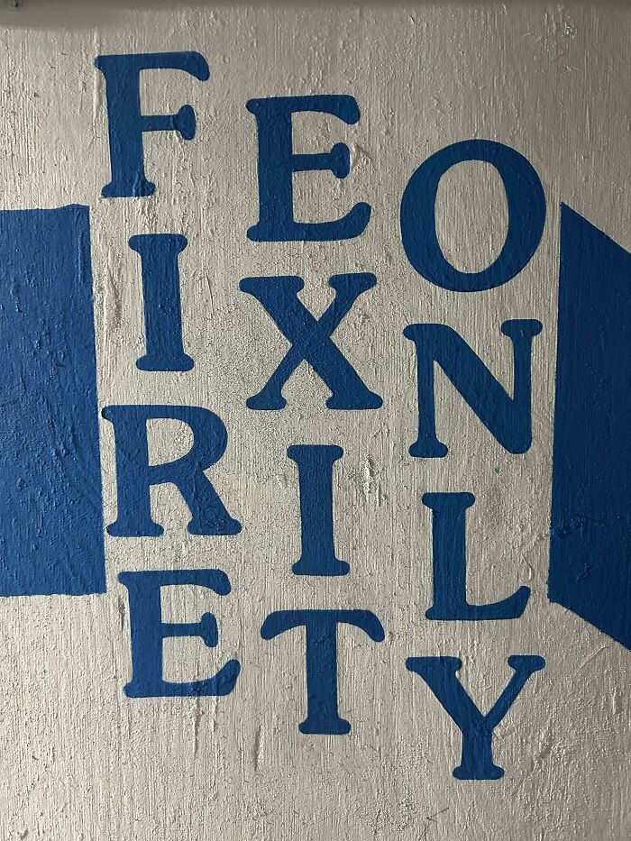 A wall with confusing text painting illustrating badly designed signs