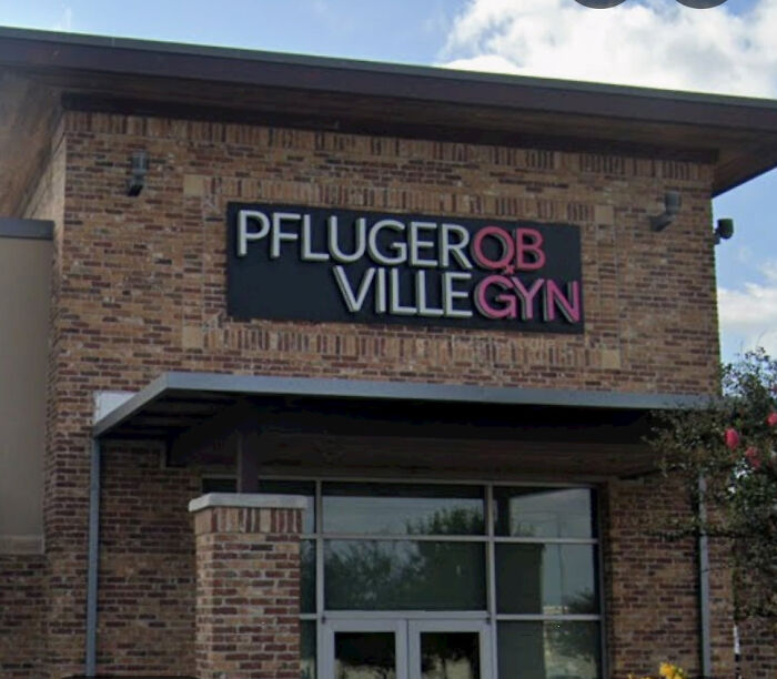 Medical office building exterior featuring confusingly colored typography as badly designed signs.
