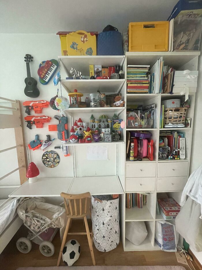 An organized playroom desk showing the cute or unhinged things wives do with toy storage.