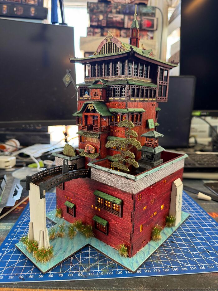 Intricate miniature bathhouse model resembling spirited away book nooks