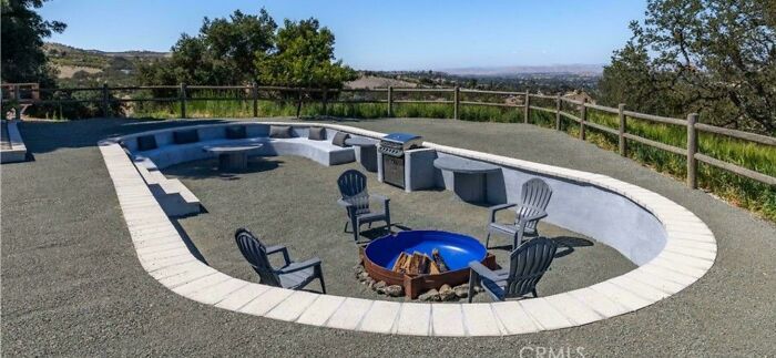 An outdoor seating pit and fire pit area built into the ground, featured in questionable DIY projects.