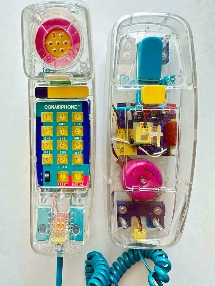A transparent Conairphone on a wall, capturing retro technology from the '90s