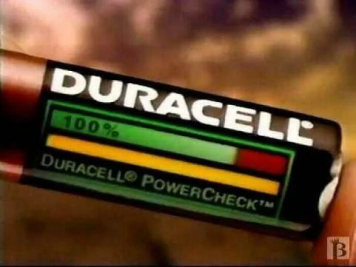 A close-up of a Duracell PowerCheck battery showing its tester strip, popular in the 90s.