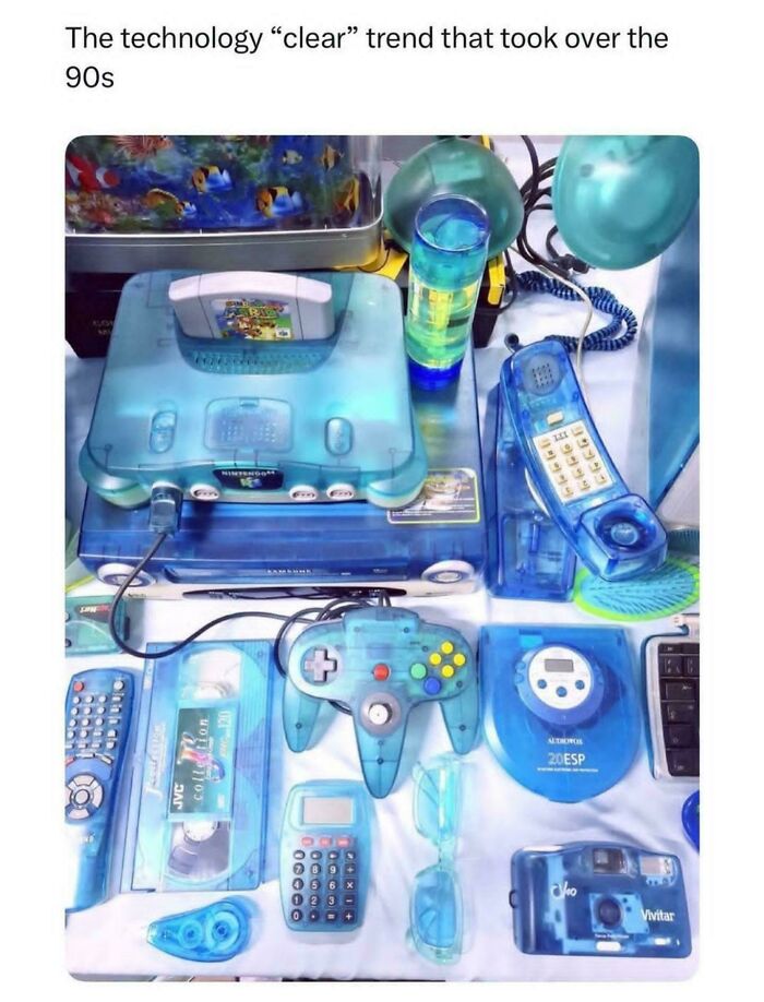 A collection of blue translucent clear tech gadgets popular in the 90s.
