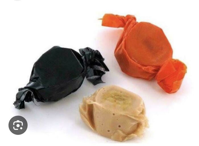 Three classic Halloween molasses candies wrapped in black and orange paper to relive the carefree days of the 90s