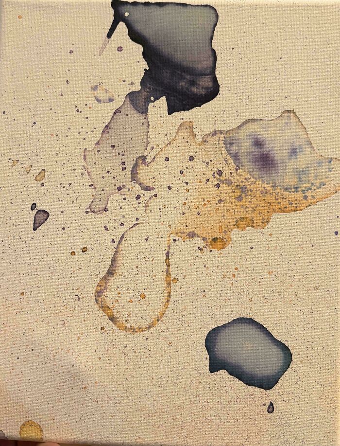 An abstract watercolor art piece on canvas created by a child, showing wholesome creative projects with dads.