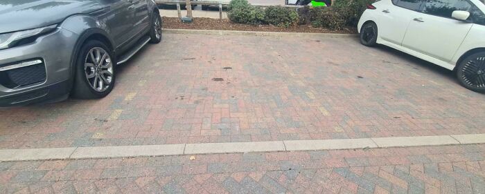 Parking Bays, Nightmare To See As A Colorblind Person And Near Impossible To Park Within The Lines At Night. Should Have Been Solid White Lines