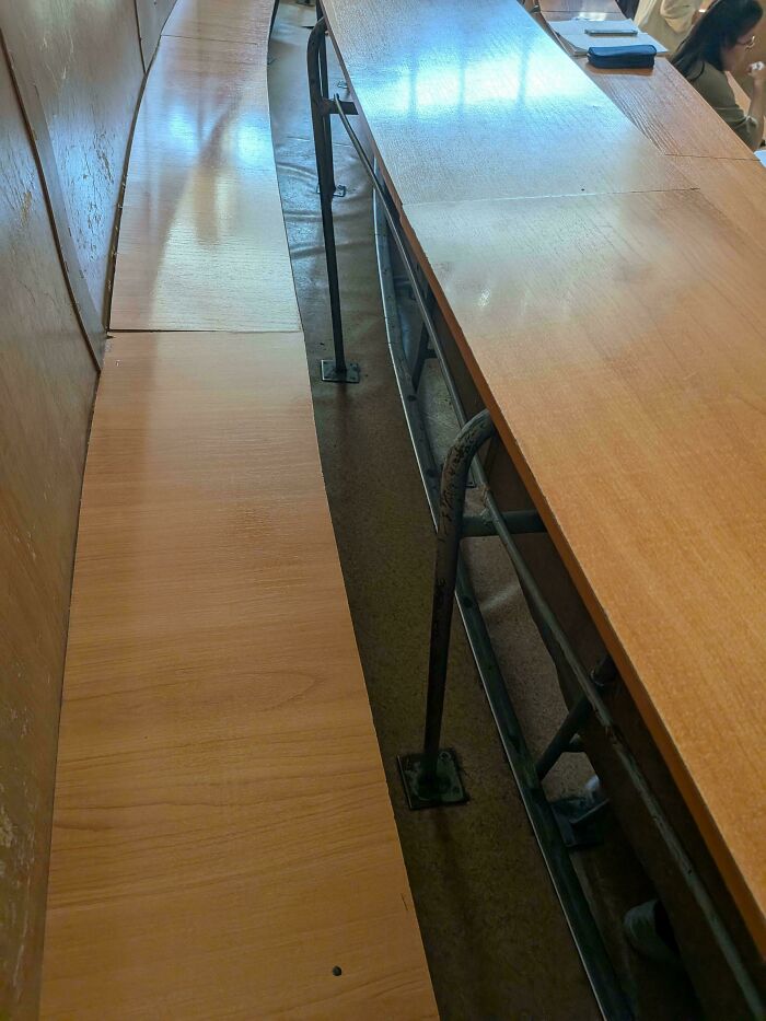 The Gap Between Seat And Rail Is So Narrow, It's Impossible To Pass Through And Sit In The Middle. Same From The Other Side Of The Desk