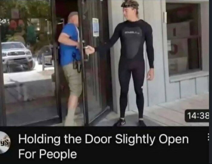 A man in a wetsuit holding a glass door open slightly, featured in funny memes.