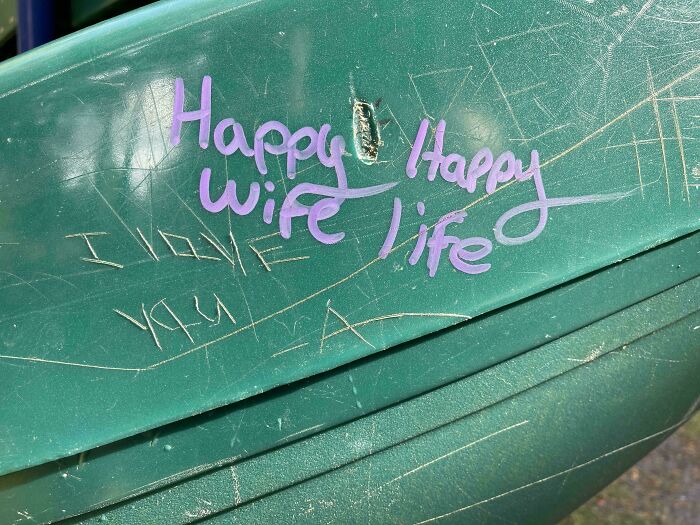 Graffiti on a green surface with confusing layout, illustrating badly designed signs.
