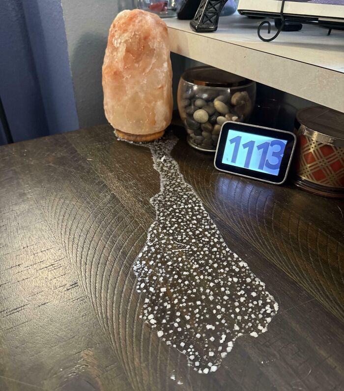 Interesting photo of a melting pink Himalayan salt lamp leaving a trail of salt crystals