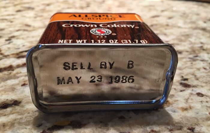 An old tin of Crown Colony ground allspice with a sell by date of May 23 1986, showing interesting photos of old spice.