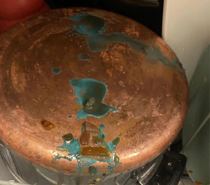 An interesting photo of a copper pot showing blue-green chemical oxidation after a dishwasher cycle