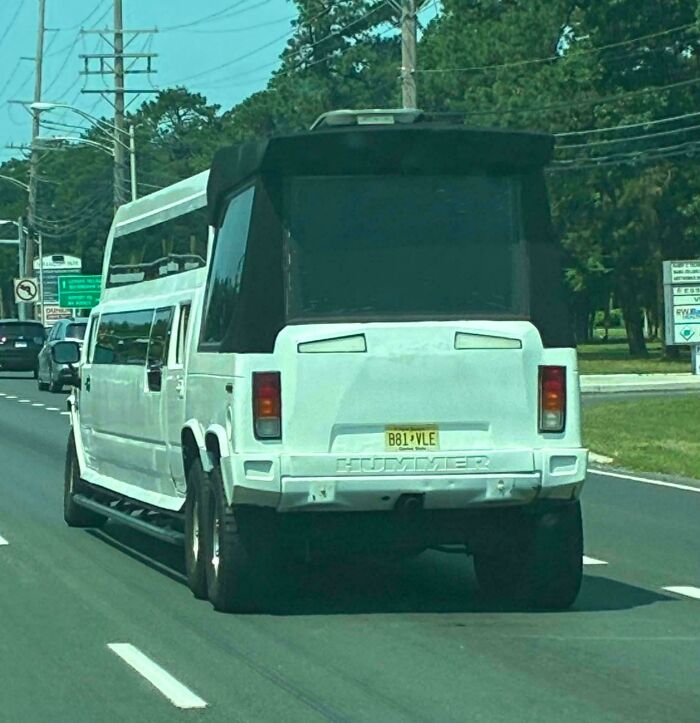 A white custom hummer limo modified into a camper, one of many creations awful to look at.
