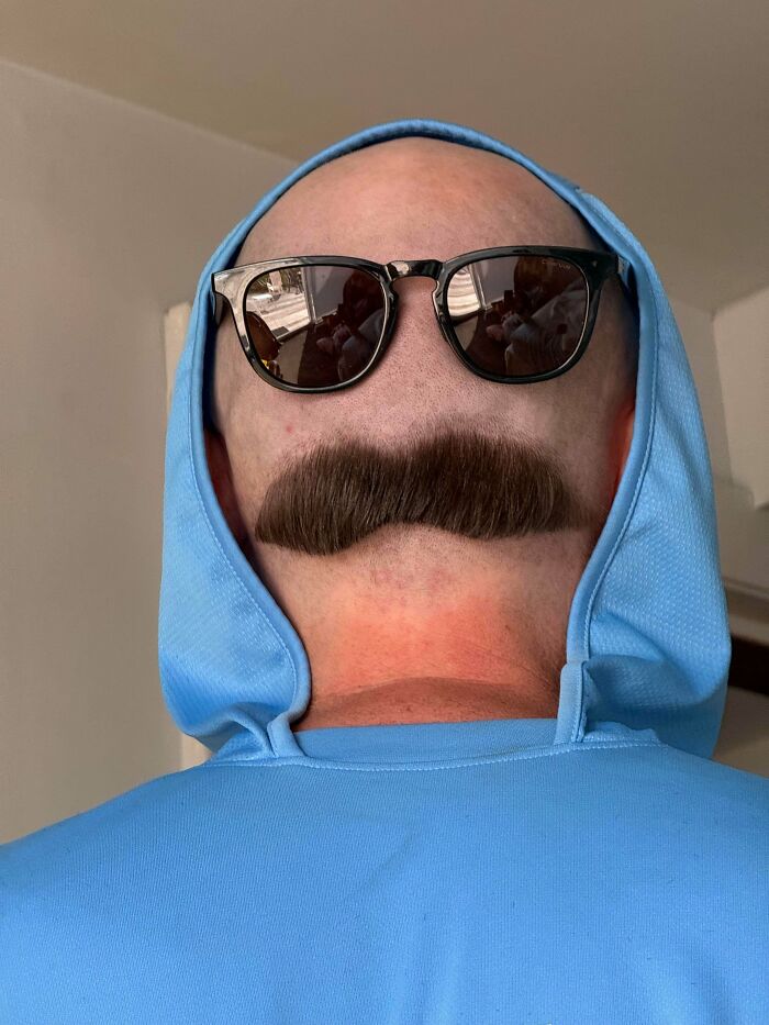 Awful creations showing a man wearing sunglasses and a mustache shaved into the back of his head.