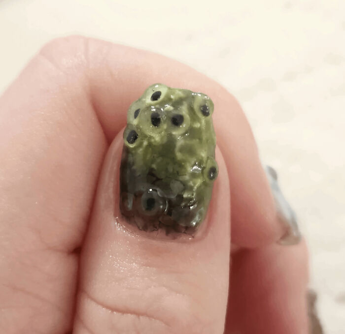Gross nail art featuring a frog spawn design, part of awful creations.