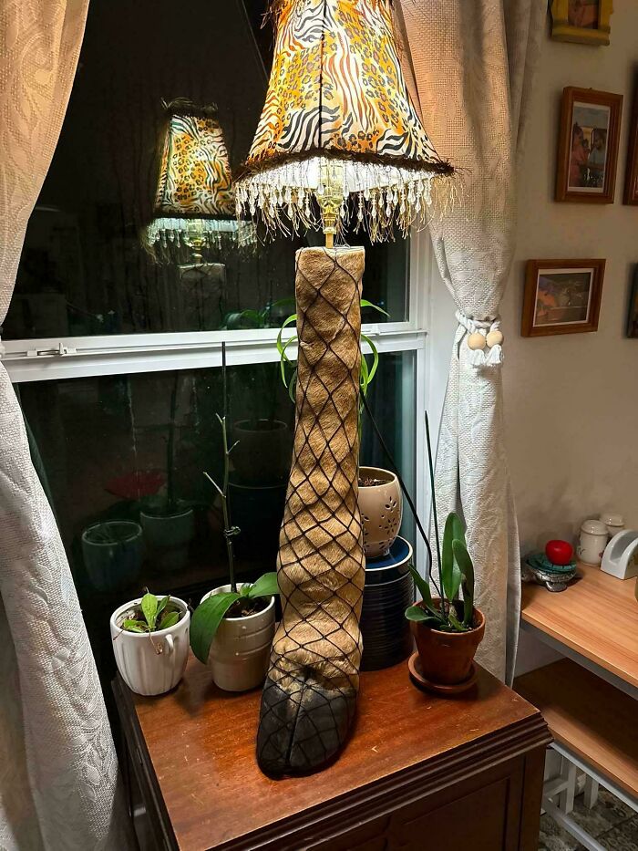 An odd lamp made from an animal leg, among awful creations.