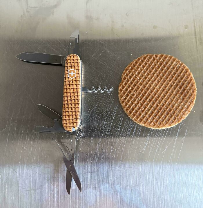 A pocket knife creation styled like a stroopwafel next to a real waffle cookie.