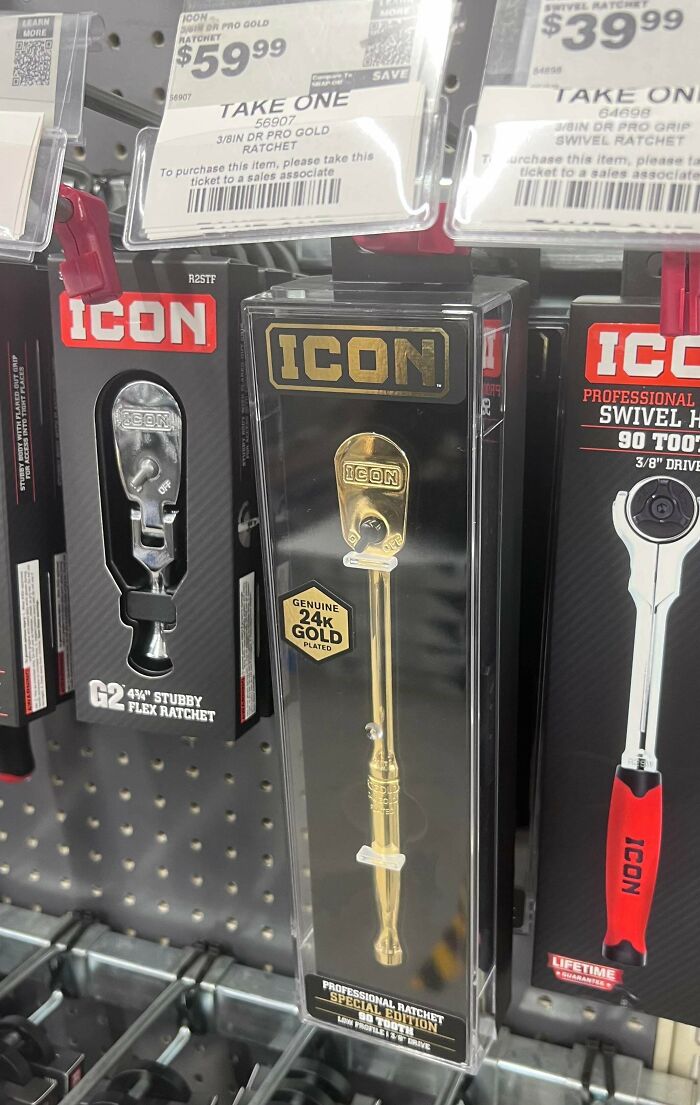 A gold-plated tool display among well-made creations in a store.