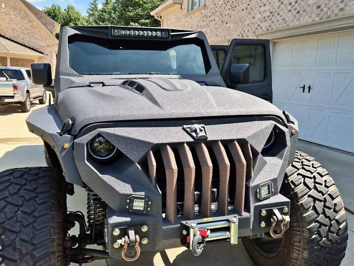 Well-made but awful creations featuring a heavily customized textured off-road vehicle with an aggressive front grille
