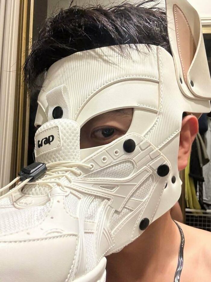 Futuristic sneaker mask worn on face as one of the creations awful to look at.