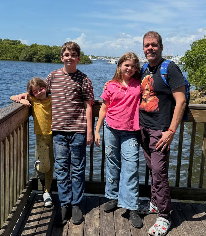 Perez Hilton with his children by the water, amidst his ongoing crisis. Perez Hilton with his children by the water, amidst his ongoing crisis.