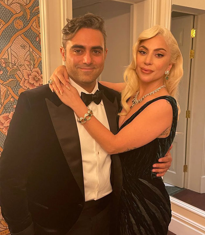 Lady Gaga and Michael Polansky at an event, receiving criticism for their baby girl name choice.