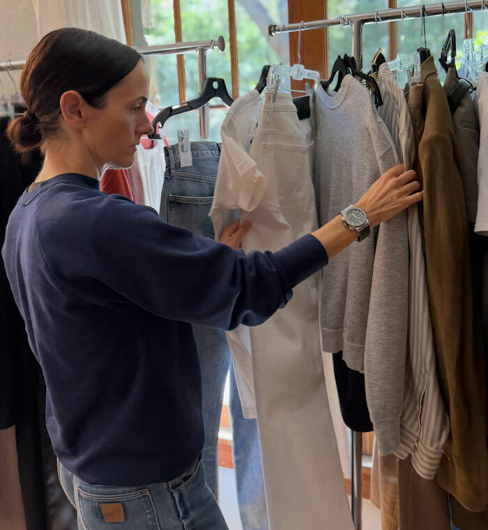 Shailene Woodley&rsquo;s stylist selecting clothes from a rack, preparing for an Emmys outfit.