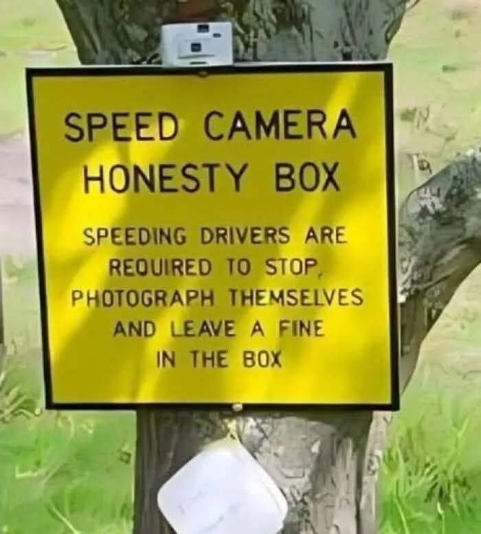 A silly sign for a speed camera honesty box asks drivers to photograph themselves and leave a fine.