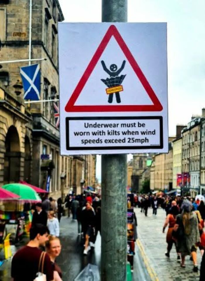 A funny sign in a city street warns that underwear must be worn with kilts when wind speeds exceed 25mph.