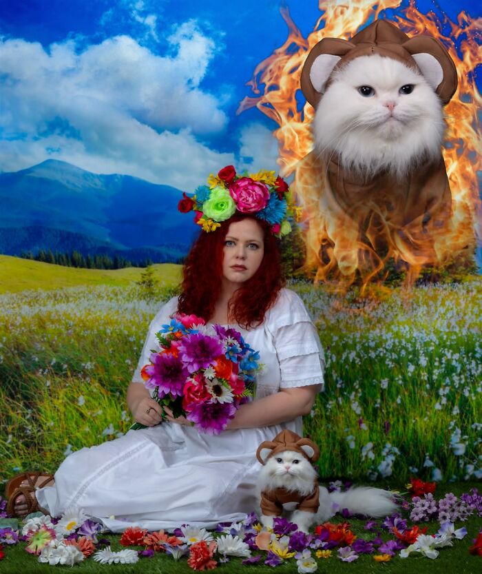 Silly portrait of pets and their owners: a woman in a flower crown with a cat in a costume, and a larger cat in flames.