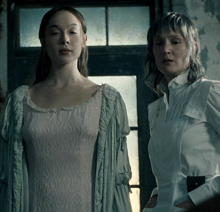 A scene from the Lizzie Borden Series featuring two female characters in historical attire A scene from the Lizzie Borden Series featuring two female characters in historical attire