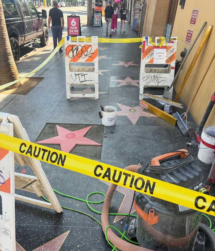 A section of the Hollywood Walk of Fame under construction with caution tape, near where someone disrespected Dolly Parton. A section of the Hollywood Walk of Fame under construction with caution tape, near where someone disrespected Dolly Parton.