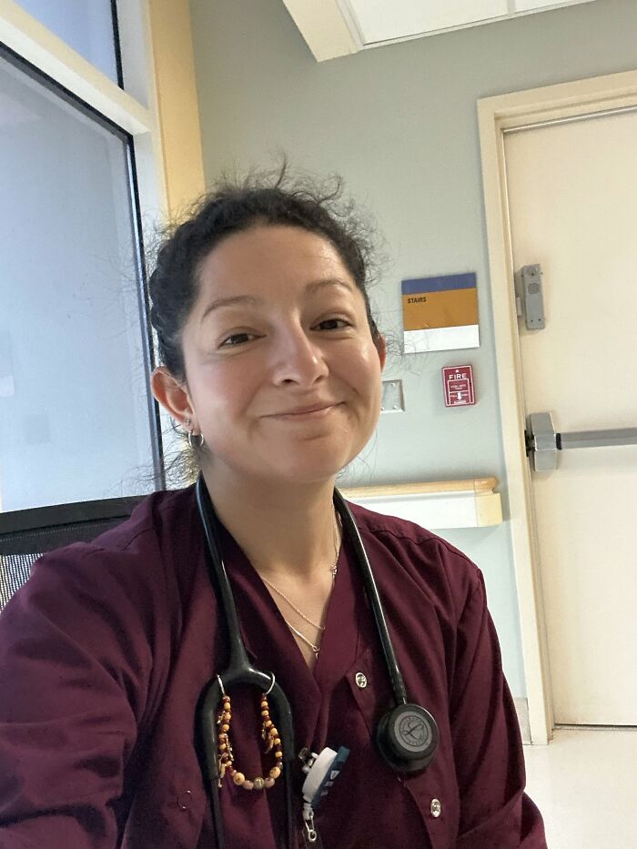 A smiling woman in scrubs with a stethoscope, showing dedication after 40 years together.