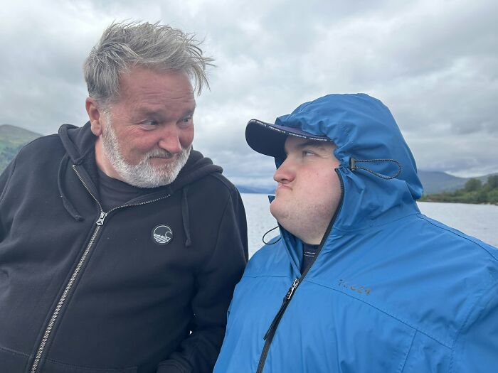 Two men, one older with a beard and one younger in a blue jacket, sharing a moment, proof of finding the right man.