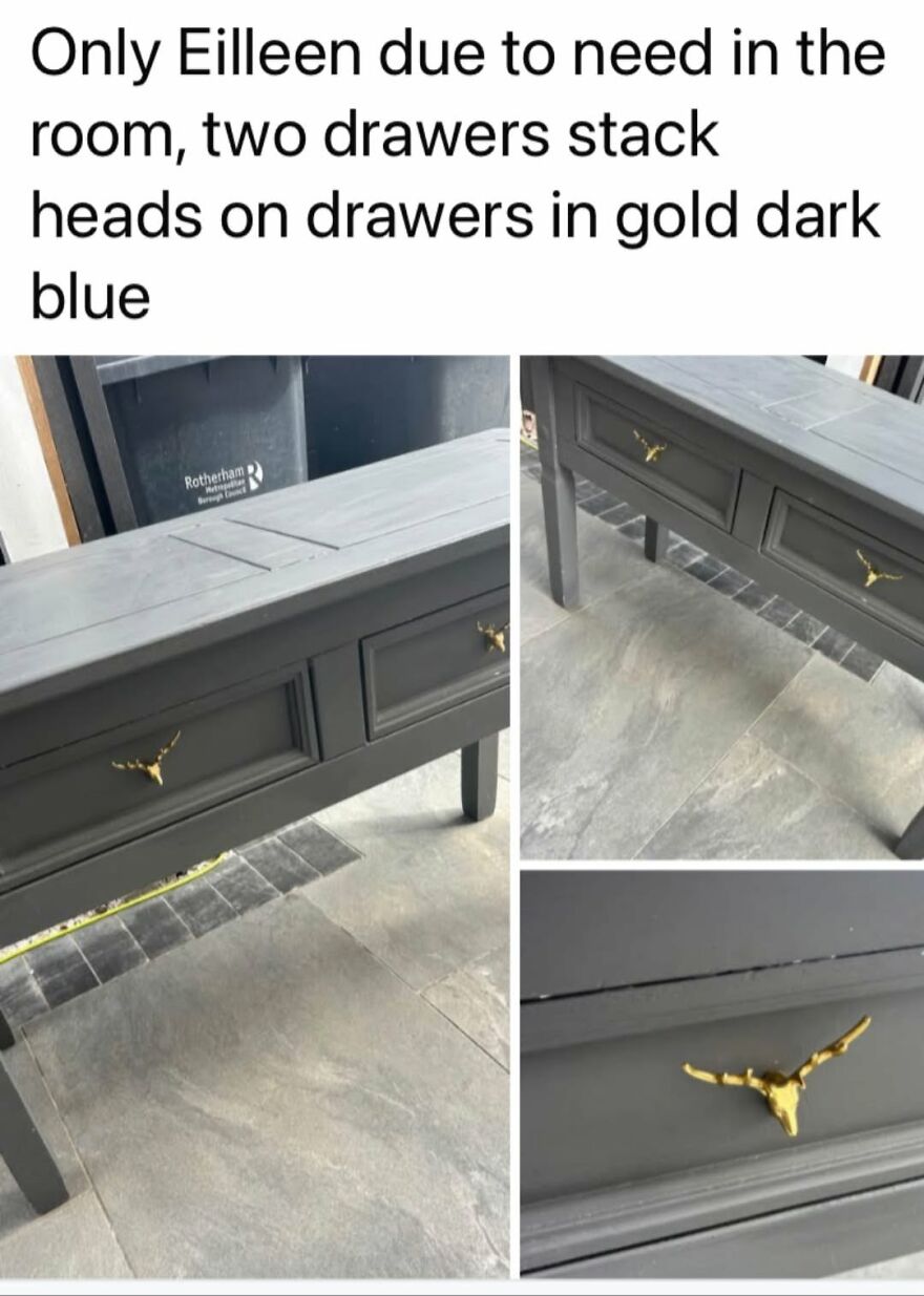 A dark blue table with stag head drawer handles showcasing grammar fails in the description.