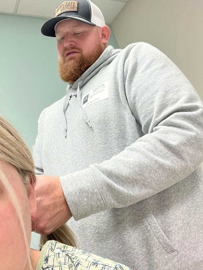 A man with a beard styling a woman's hair, proof of finding the right man.