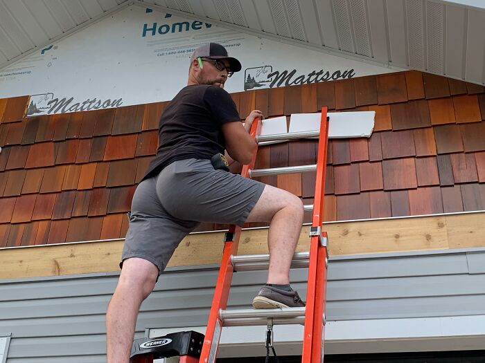 A man working on the roof of a house, proof of finding the right man.