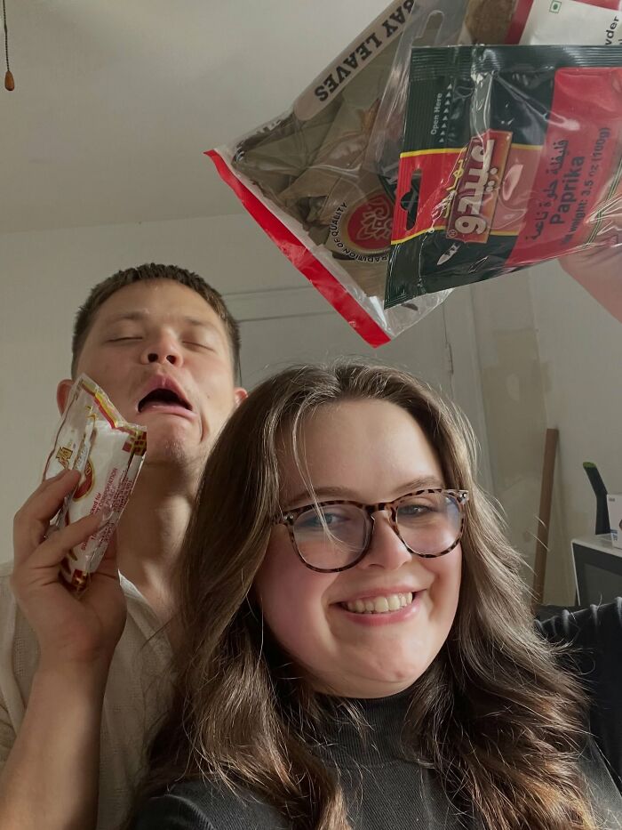 A laughing woman with glasses and a man making a funny face, showing proof of the right man.