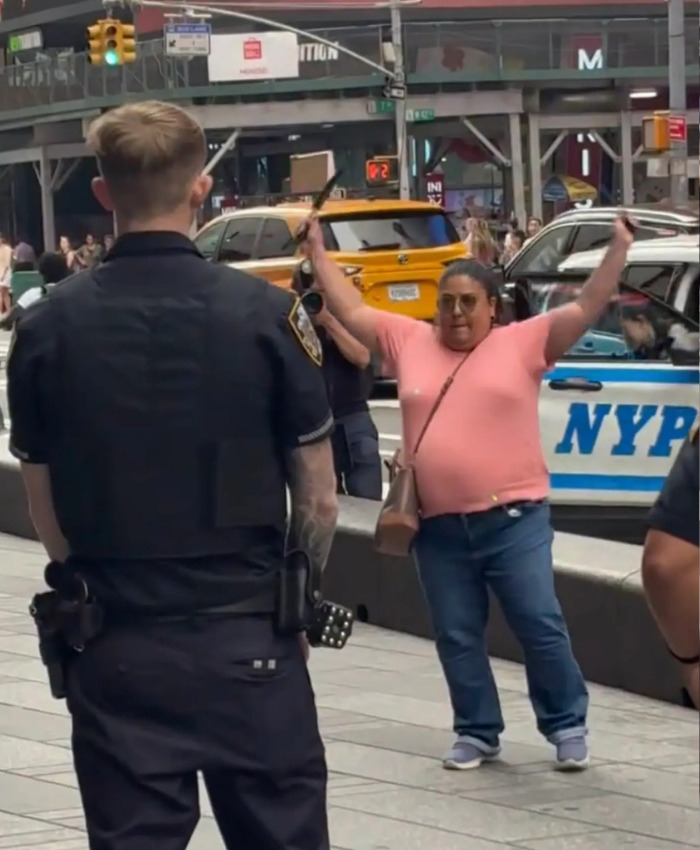 Dramatic video shows the Times Square attacker with hands raised during confrontation with cops. Dramatic video shows the Times Square attacker with hands raised during confrontation with cops.