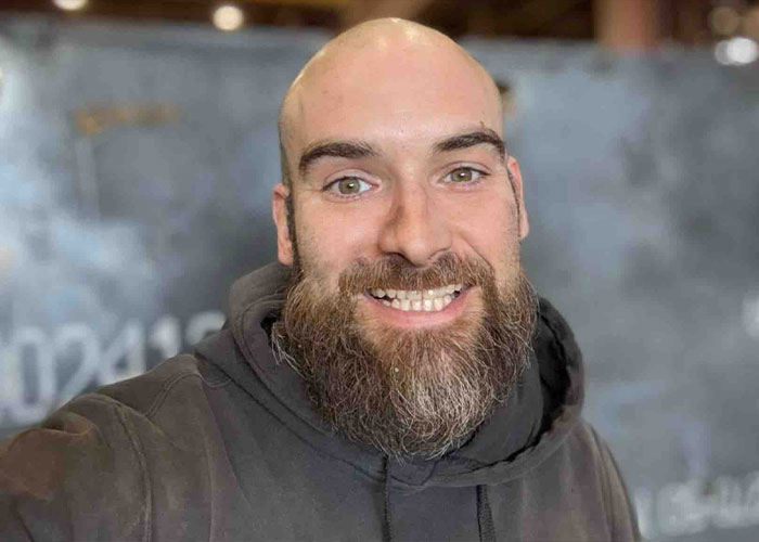 Close-up of a smiling bald man with a beard, who used his last words to identify his children's mother as his attacker. Close-up of a smiling bald man with a beard, who used his last words to identify his children's mother as his attacker.