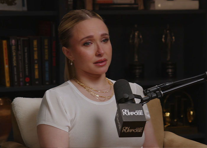 Hayden Panettiere looks emotional speaking into a podcast microphone with a worried expression. Hayden Panettiere looks emotional speaking into a podcast microphone with a worried expression.