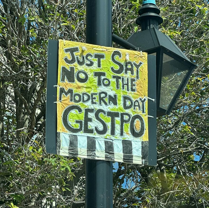 An outdoor protest sign showing a hand-drawn spelling and grammar fail.