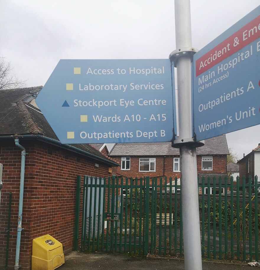 Hospital direction sign showing spelling grammar fails with Laborotary Services
