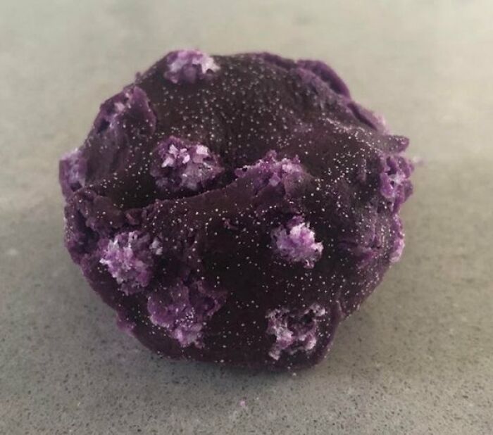 An interesting photo of what happens if a purple playdough ball is left out and grows salt crystals.