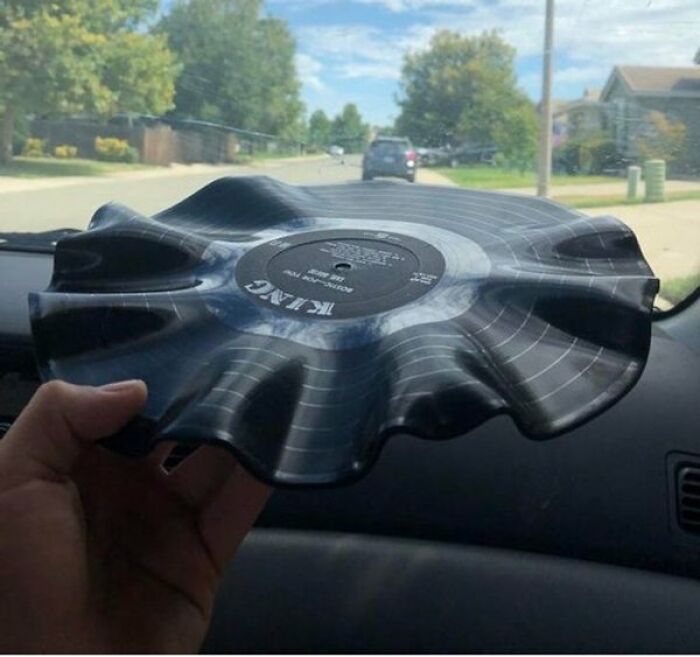 Interesting and cool photos of a vinyl record warped and melted by heat inside a car